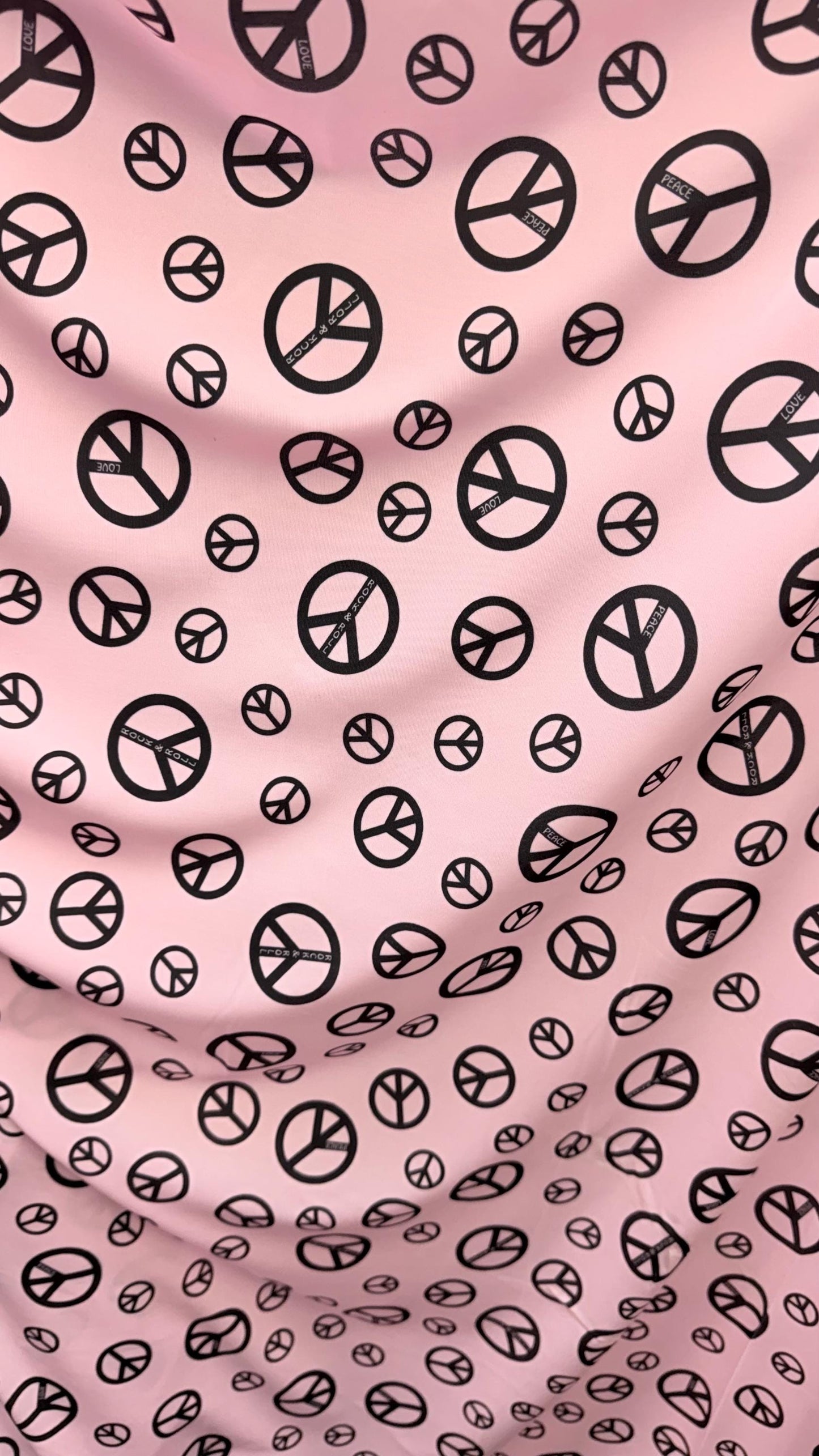 Love and Peace design print on great quality of nylon spandex 4way stretch 58/60" Sold by the YD. Ships worldwide from Los Angeles CA USA