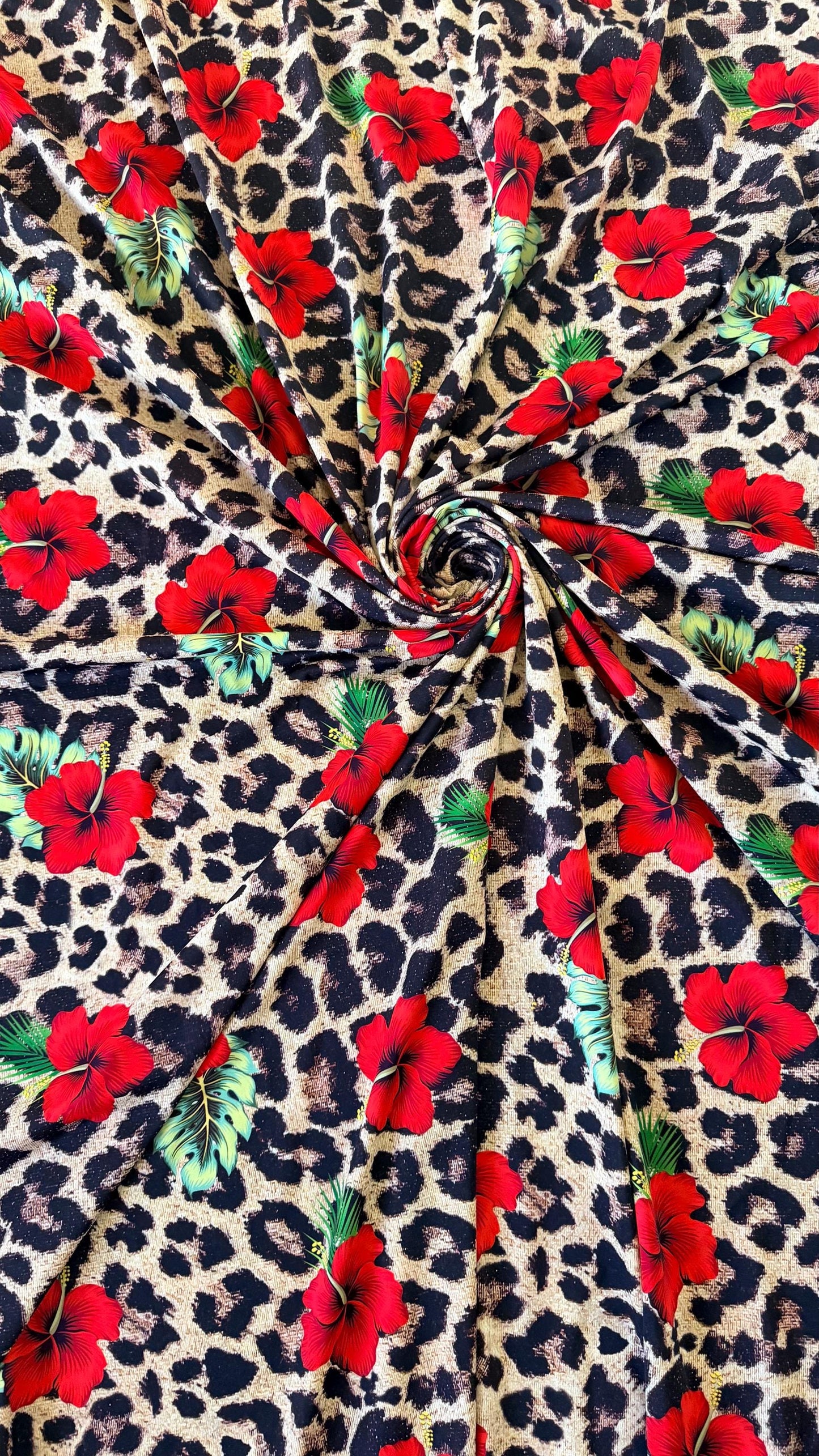 New Hiding Leopard design with red flowers Nylon Spandex 4-way stretch 58/60” High quality fabrics by AlexLAFabrics