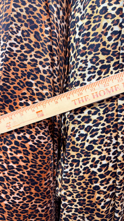 NEW Leopard Exotic design print on nylon Spandex 4-way stretch 58/60” Sold by the YD. Ships worldwide from Los Angeles California USA.