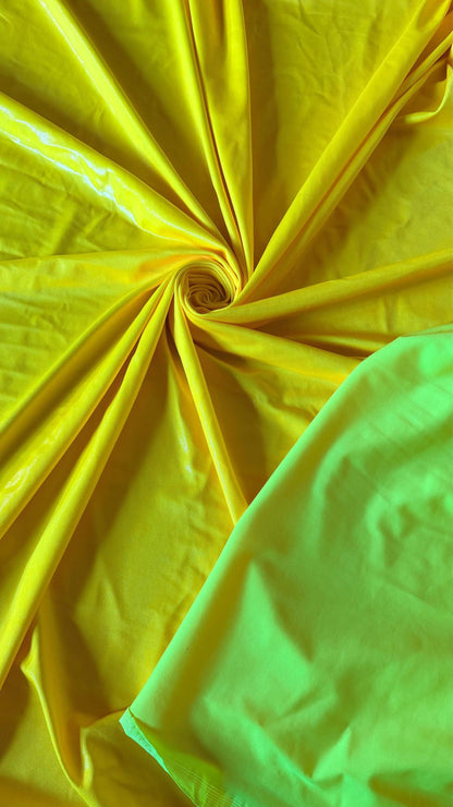 New Neon Yellow foggy foil nylon spandex 4way stretch 58/60" Sold by the YD. Ships worldwide from Los Angeles California USA.