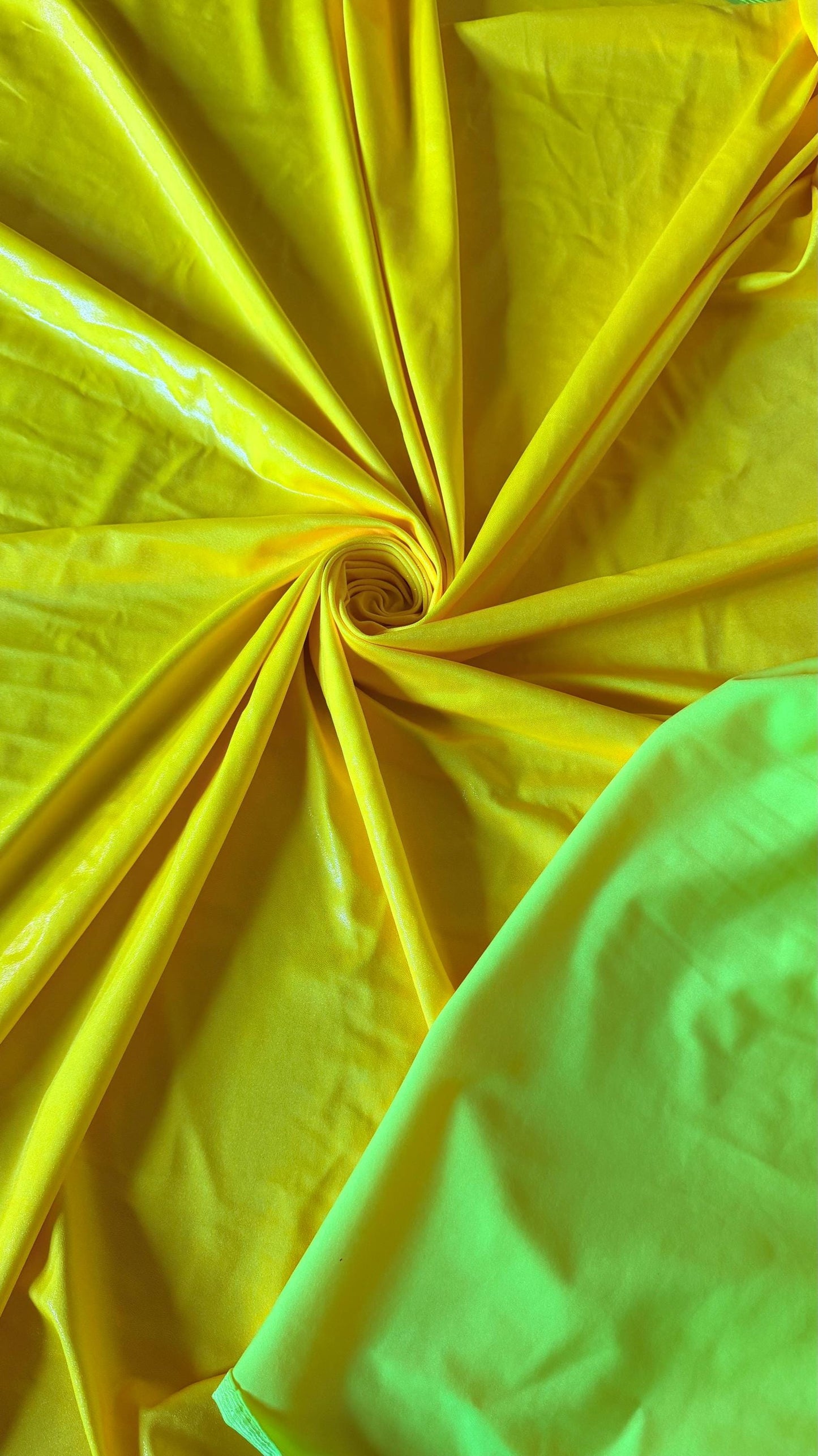 New Neon Yellow foggy foil nylon spandex 4way stretch 58/60" Sold by the YD. Ships worldwide from Los Angeles California USA.