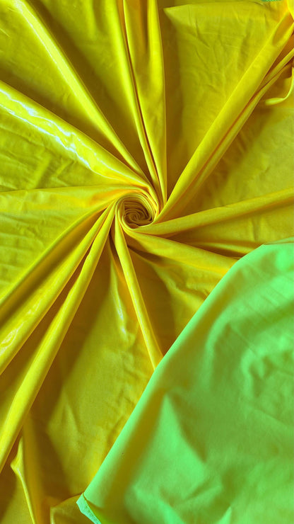 New Neon Yellow foggy foil nylon spandex 4way stretch 58/60" Sold by the YD. Ships worldwide from Los Angeles California USA.