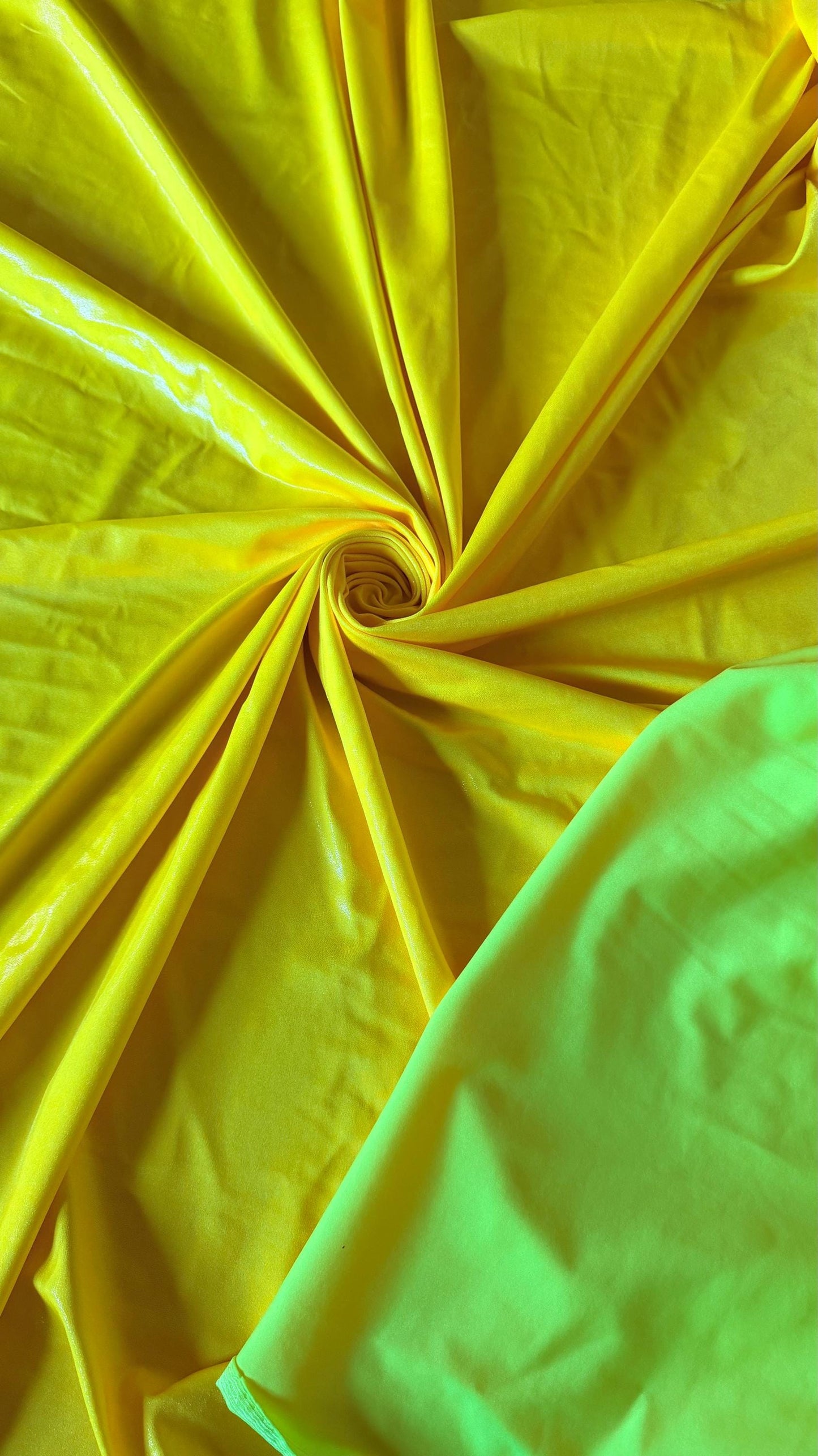 New Neon Yellow foggy foil nylon spandex 4way stretch 58/60" Sold by the YD. Ships worldwide from Los Angeles California USA.