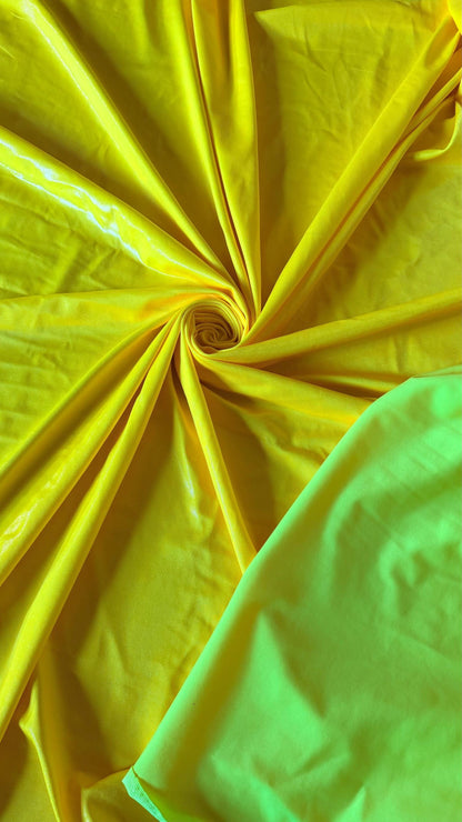 New Neon Yellow foggy foil nylon spandex 4way stretch 58/60" Sold by the YD. Ships worldwide from Los Angeles California USA.