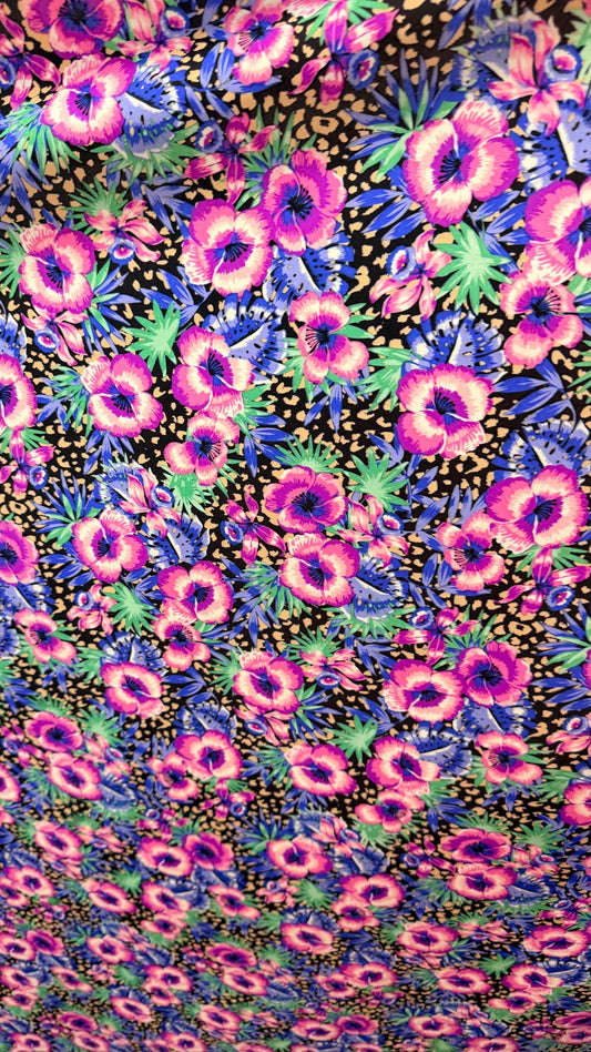 New Hiding Cheetah with flower design multicolor on nylon spandex 4way stretch 58/60" Sold by the YD. Ships worldwide from Los Angeles CA