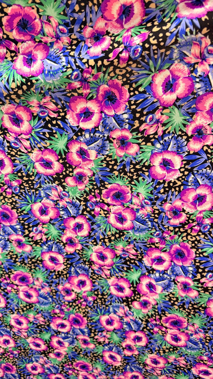 New Hiding Cheetah with flower design multicolor on nylon spandex 4way stretch 58/60" Sold by the YD. Ships worldwide from Los Angeles CA