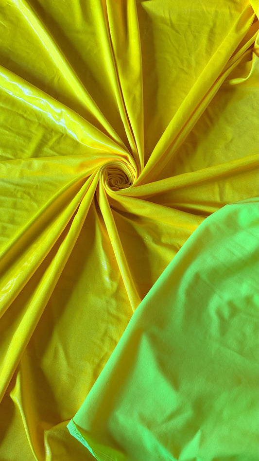 New Neon Yellow foggy foil nylon spandex 4way stretch 58/60" Sold by the YD. Ships worldwide from Los Angeles California USA.