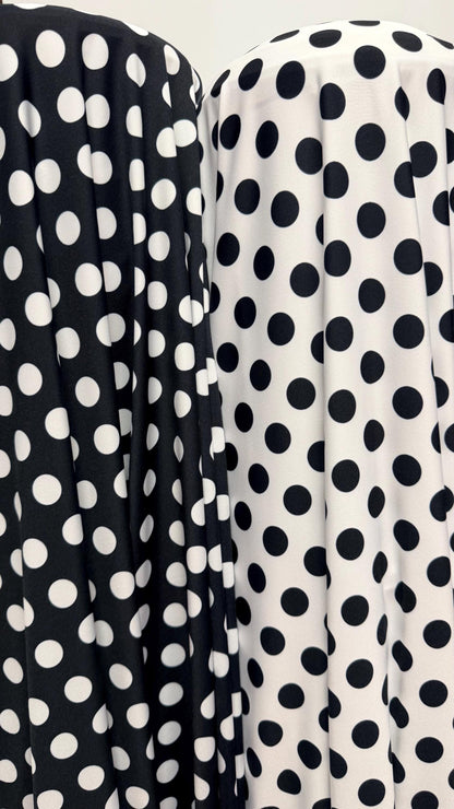 Polka dots print on poly spandex 4way stretch  58/60" sold by the Yd. Ships worldwide from Los Angeles California USA. High quality fabrics