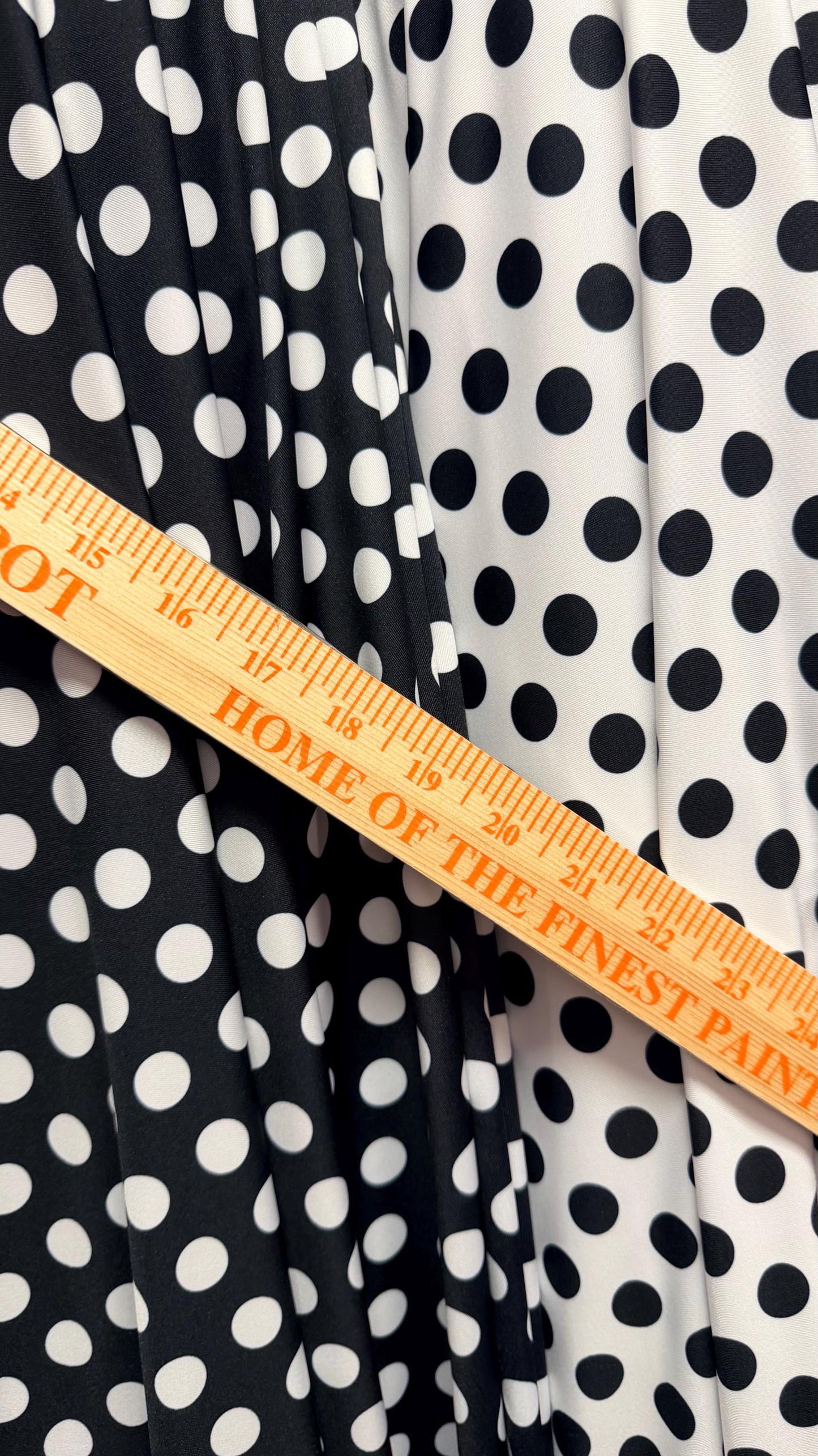 Polka dots print on poly spandex 4way stretch  58/60" sold by the Yd. Ships worldwide from Los Angeles California USA. High quality fabrics