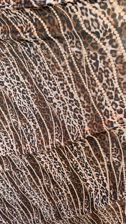 New exotic metallic leopard design poly spandex 4-way stretch  58/60” Sold by the YD. Ships worldwide from Los Angeles California USA