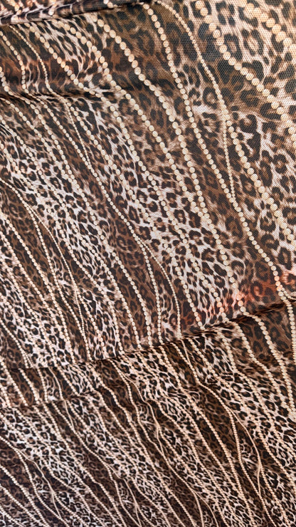 New exotic metallic leopard design poly spandex 4-way stretch  58/60” Sold by the YD. Ships worldwide from Los Angeles California USA