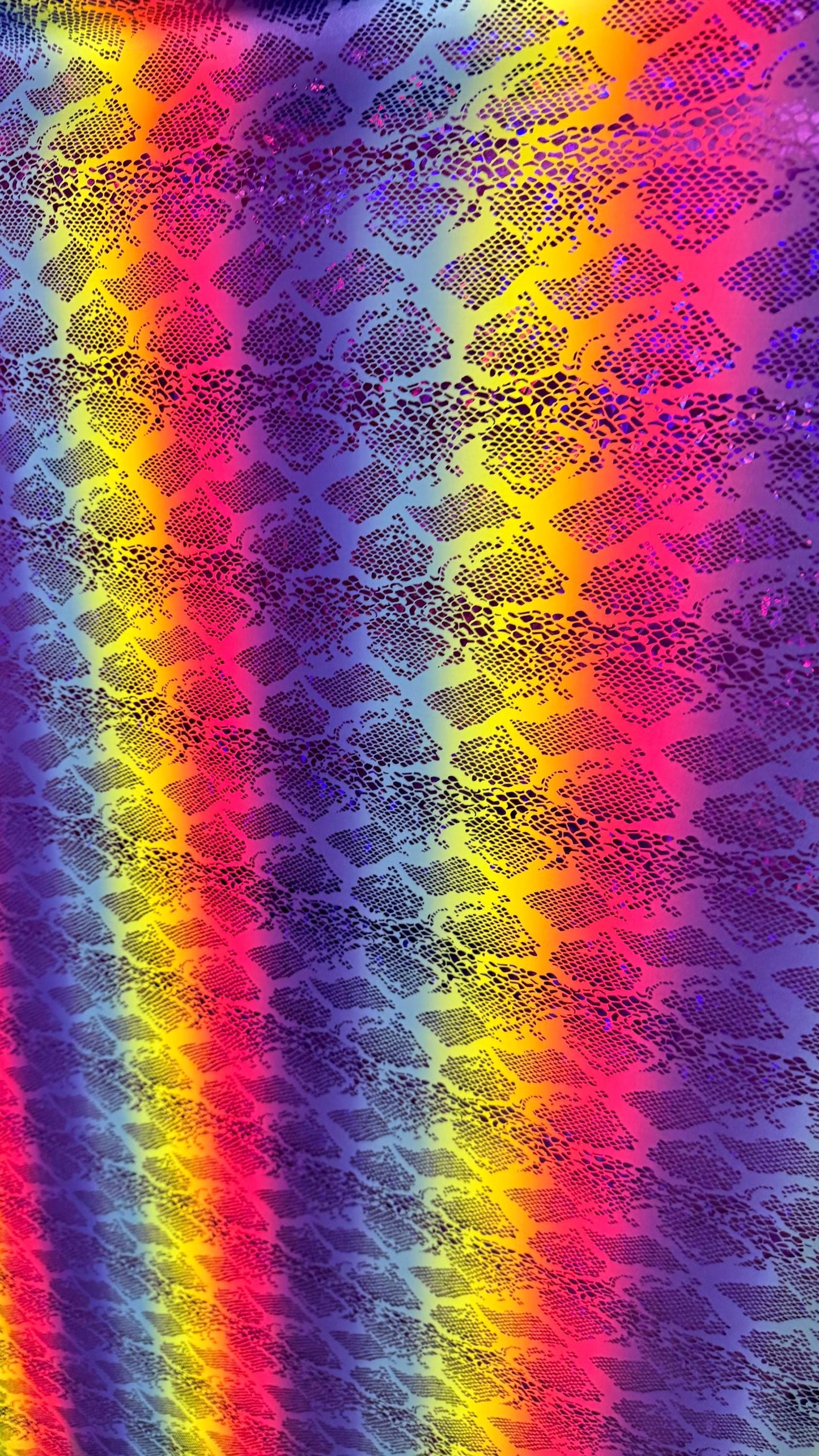 New Iridescent rainbow hologram snake design with  ilusión foil metallic nylon spandex  4way stretch 58/60" Sold by the YD. Ships worldwide