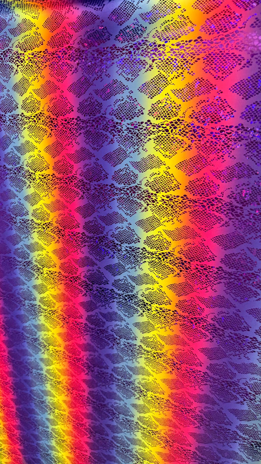 New Iridescent rainbow hologram snake design with  ilusión foil metallic nylon spandex  4way stretch 58/60" Sold by the YD. Ships worldwide