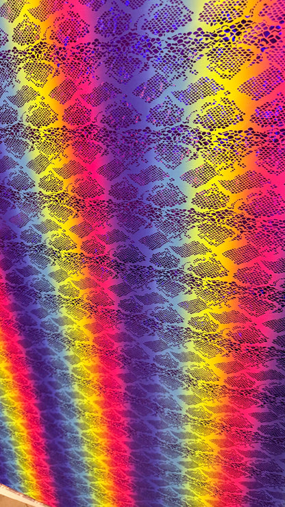 New Iridescent rainbow hologram snake design with  ilusión foil metallic nylon spandex  4way stretch 58/60" Sold by the YD. Ships worldwide