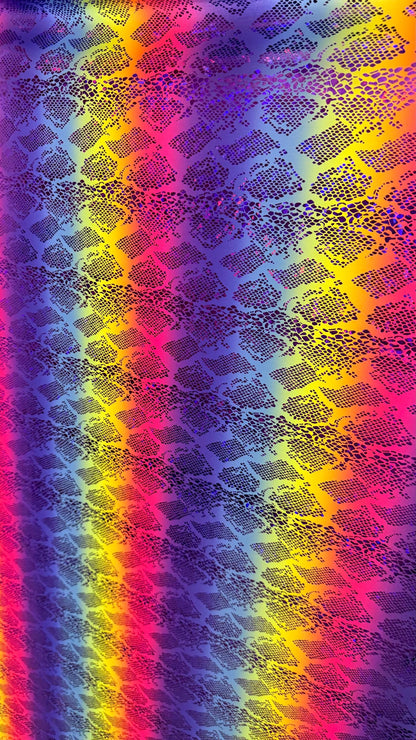 New Iridescent rainbow hologram snake design with  ilusión foil metallic nylon spandex  4way stretch 58/60" Sold by the YD. Ships worldwide