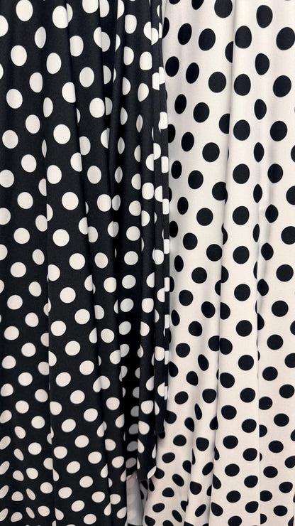 Polka dots print on poly spandex 4way stretch  58/60" sold by the Yd. Ships worldwide from Los Angeles California USA. High quality fabrics