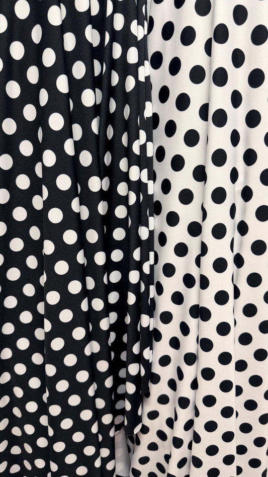Polka dots print on poly spandex 4way stretch  58/60" sold by the Yd. Ships worldwide from Los Angeles California USA. High quality fabrics