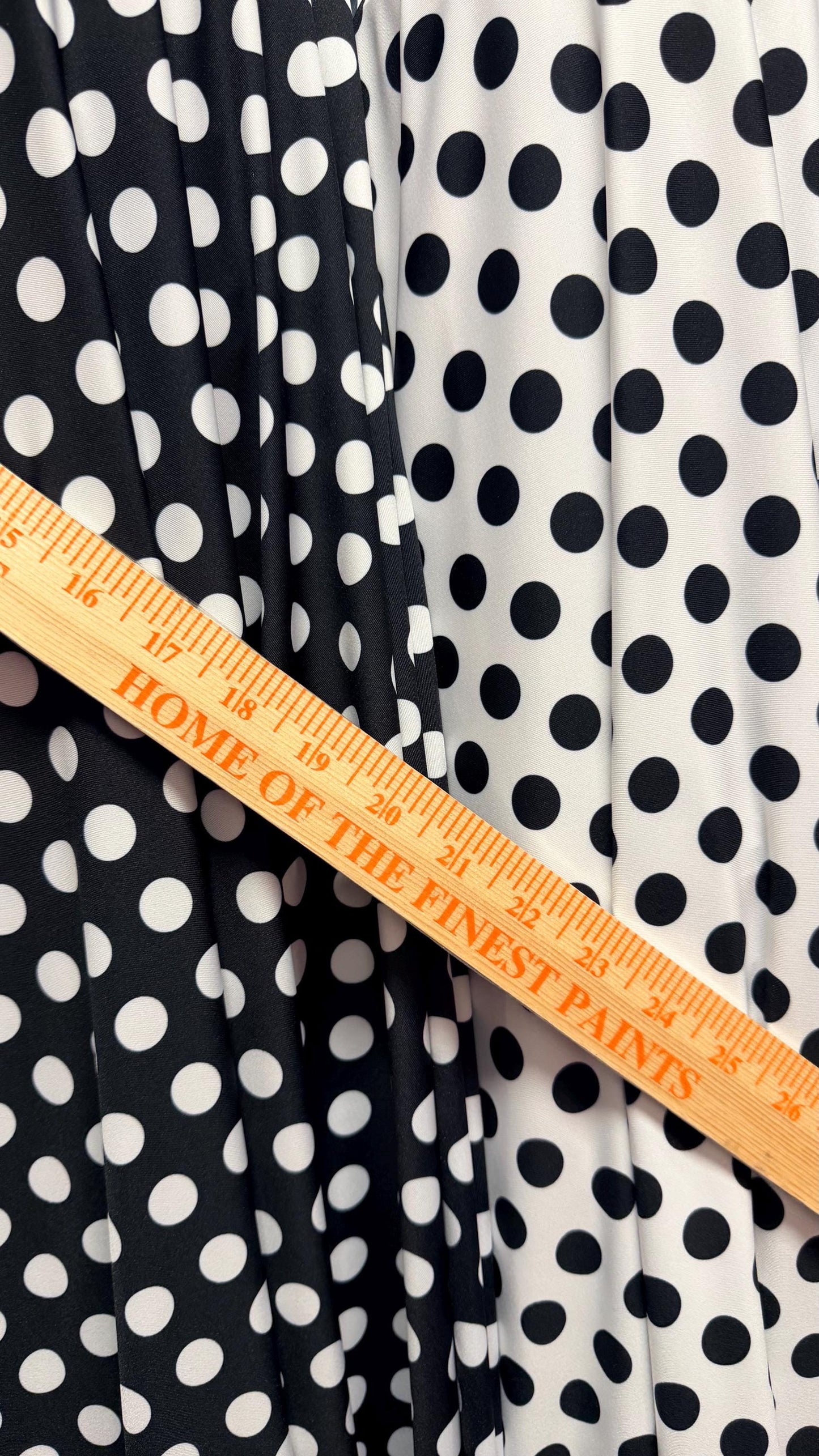 Polka dots print on poly spandex 4way stretch  58/60" sold by the Yd. Ships worldwide from Los Angeles California USA. High quality fabrics