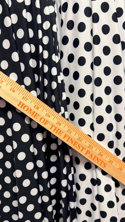 Polka dots print on poly spandex 4way stretch  58/60" sold by the Yd. Ships worldwide from Los Angeles California USA. High quality fabrics