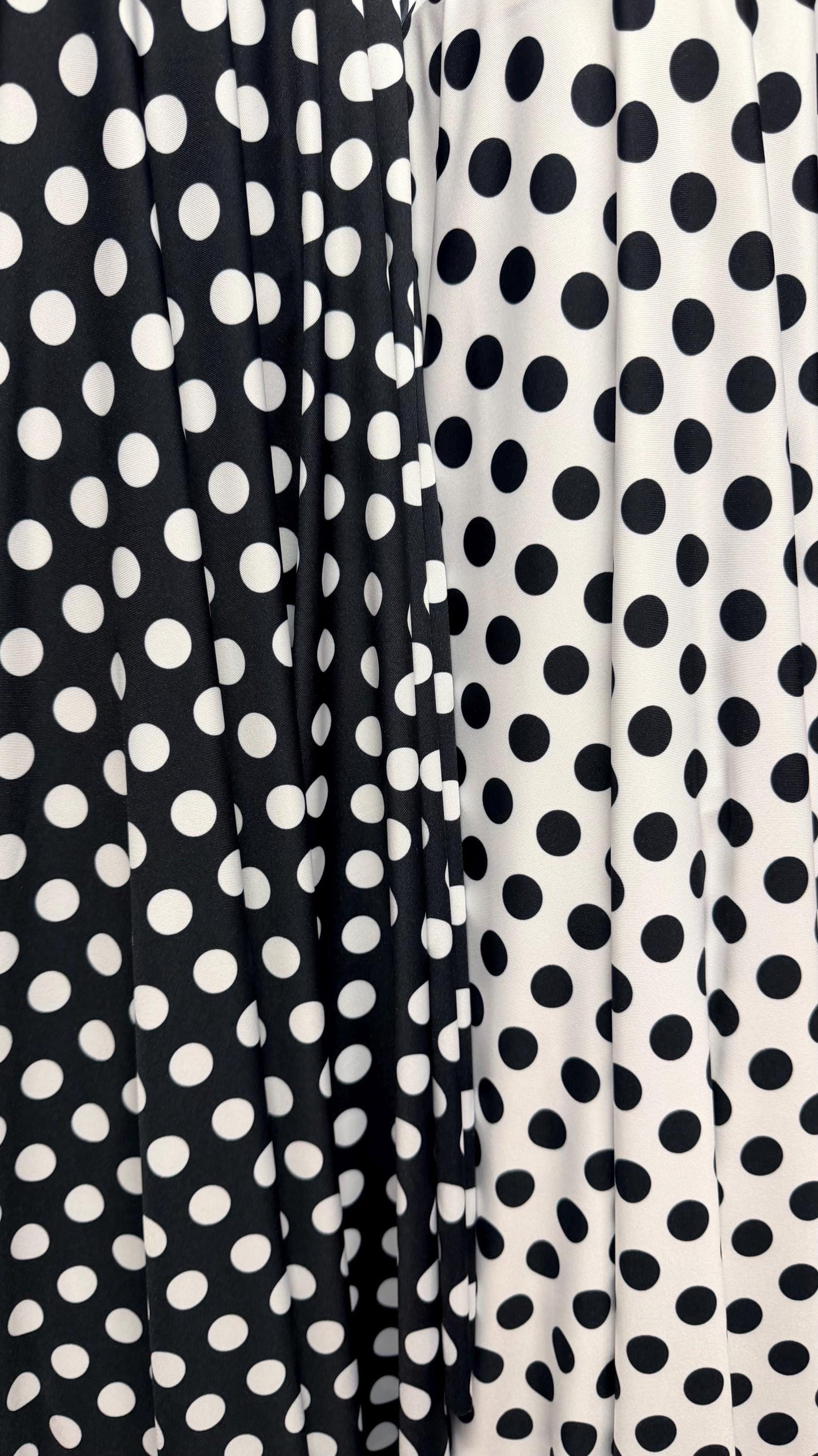 Polka dots print on poly spandex 4way stretch  58/60" sold by the Yd. Ships worldwide from Los Angeles California USA. High quality fabrics