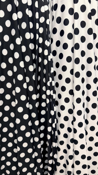 Polka dots print on poly spandex 4way stretch  58/60" sold by the Yd. Ships worldwide from Los Angeles California USA. High quality fabrics