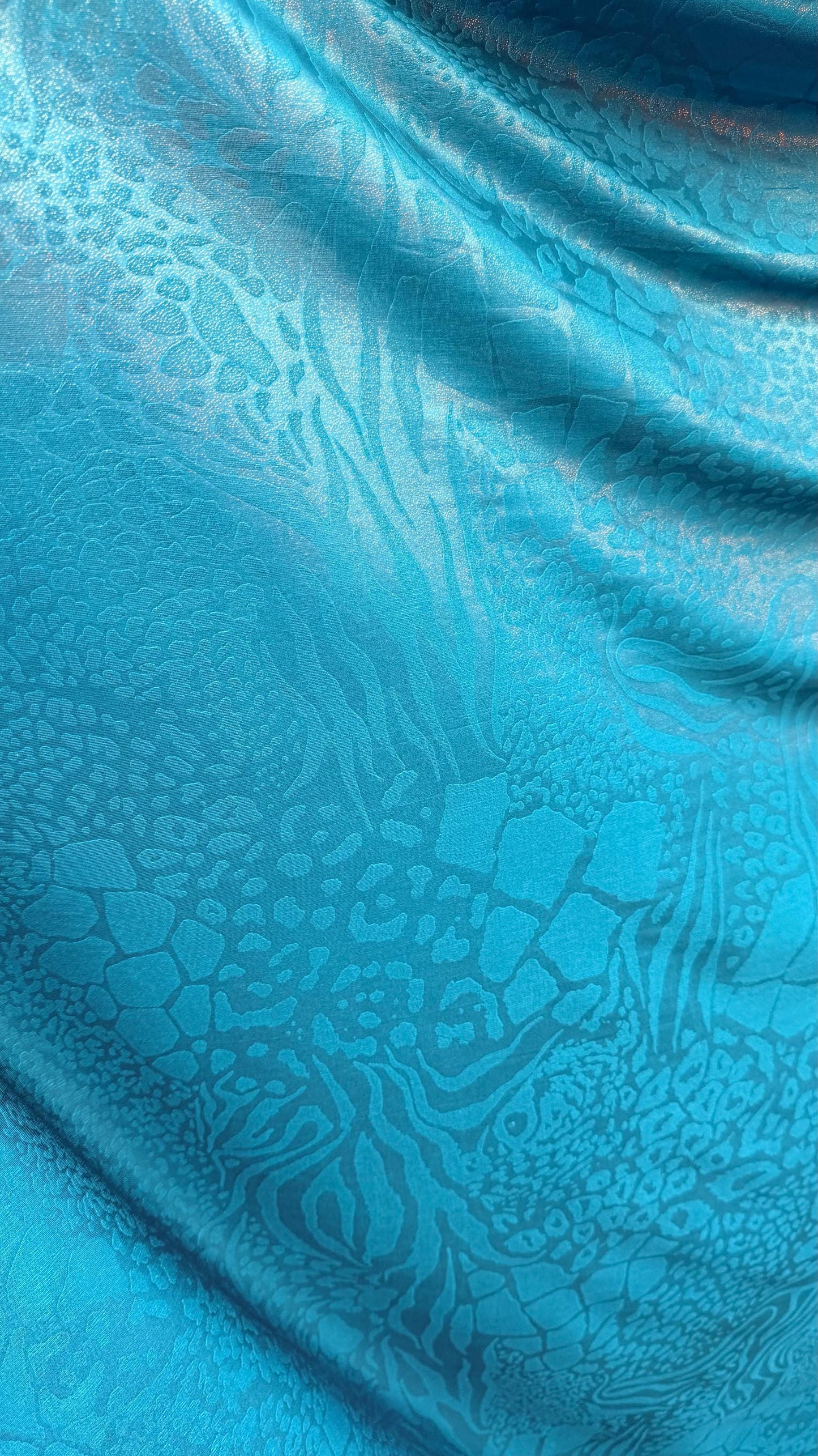 New Safari design embossed nylon spandex 4-way stretch with foil  58/60” Sold by the YD. Ships Worldwide from Los Angeles California USA
