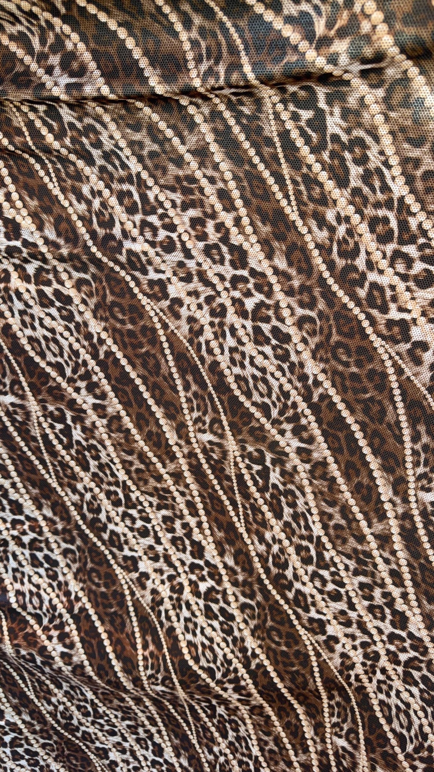 New exotic metallic leopard design poly spandex 4-way stretch  58/60” Sold by the YD. Ships worldwide from Los Angeles California USA
