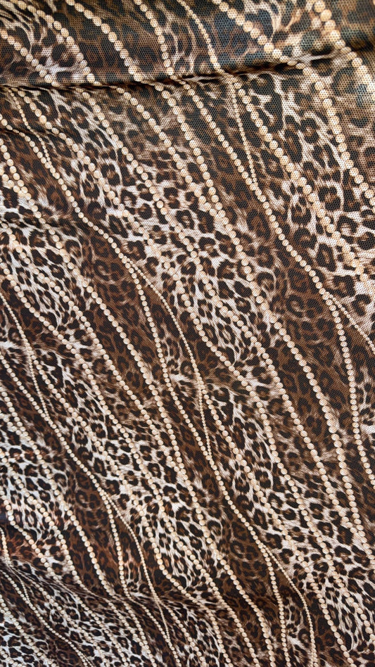 New exotic metallic leopard design poly spandex 4-way stretch  58/60” Sold by the YD. Ships worldwide from Los Angeles California USA
