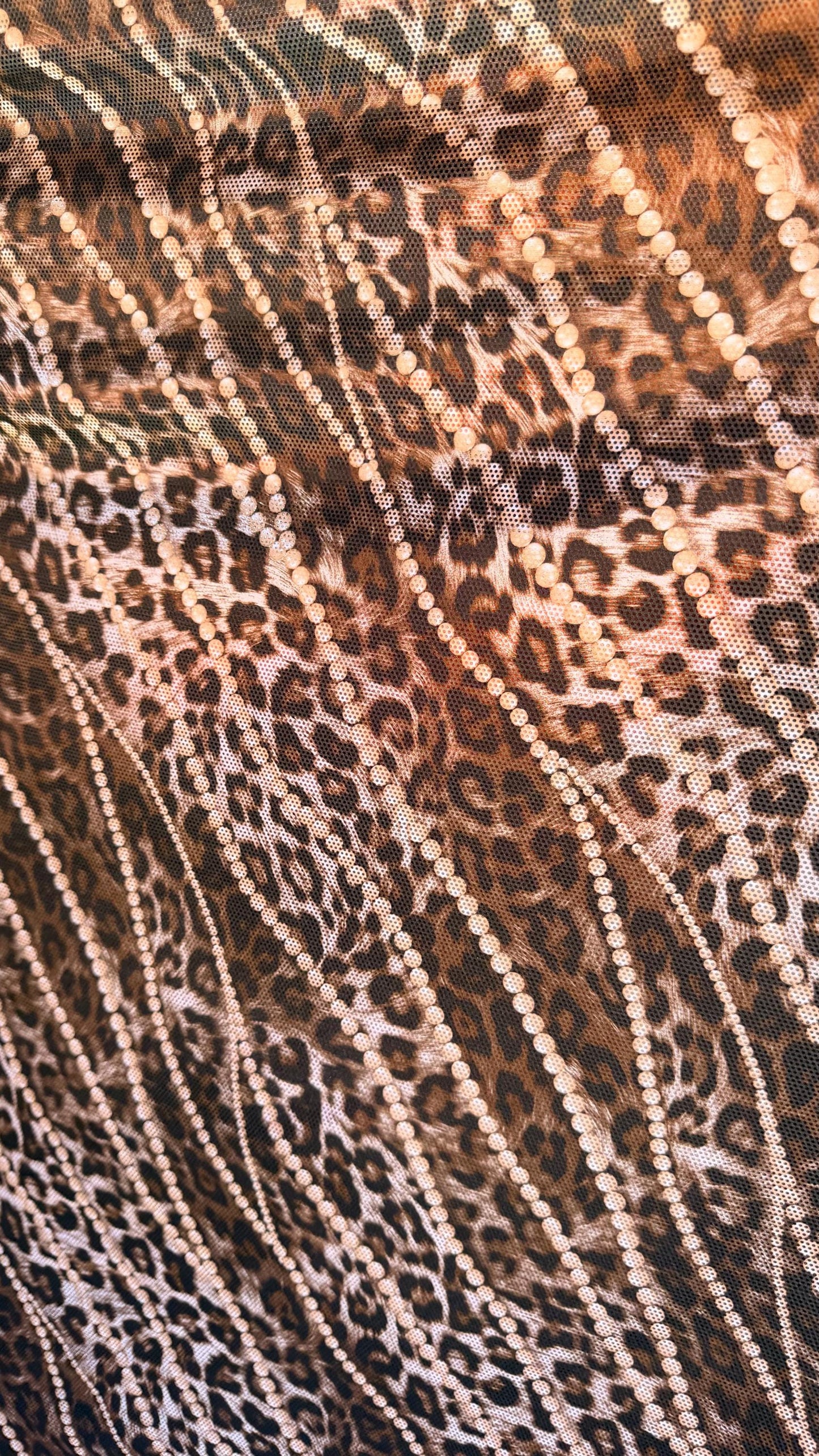 New exotic metallic leopard design poly spandex 4-way stretch  58/60” Sold by the YD. Ships worldwide from Los Angeles California USA