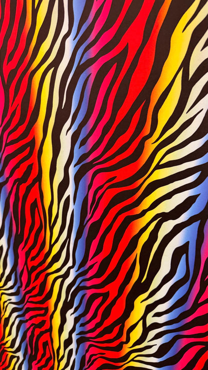 Rainbow zebra design print on nylon spandex 4way stretch 58/60" Sold by the YD. Ships worldwide from Los Angeles California USA.