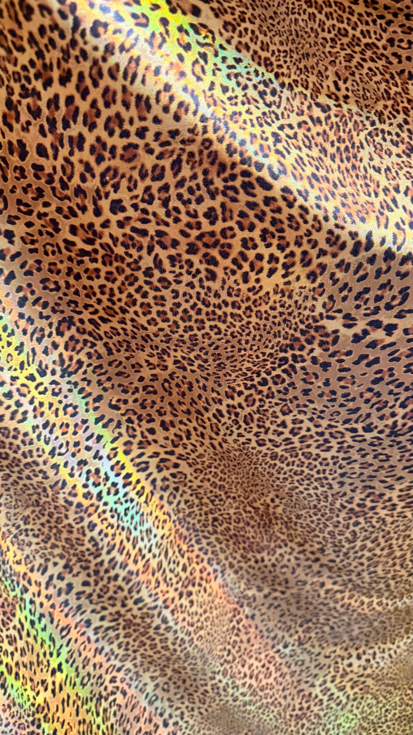New Exotic cheetah  design Iridescent metallic hologram nylon spandex 4-way spandex 58/60” Sold by the YD. Ships worldwide from Los Angeles