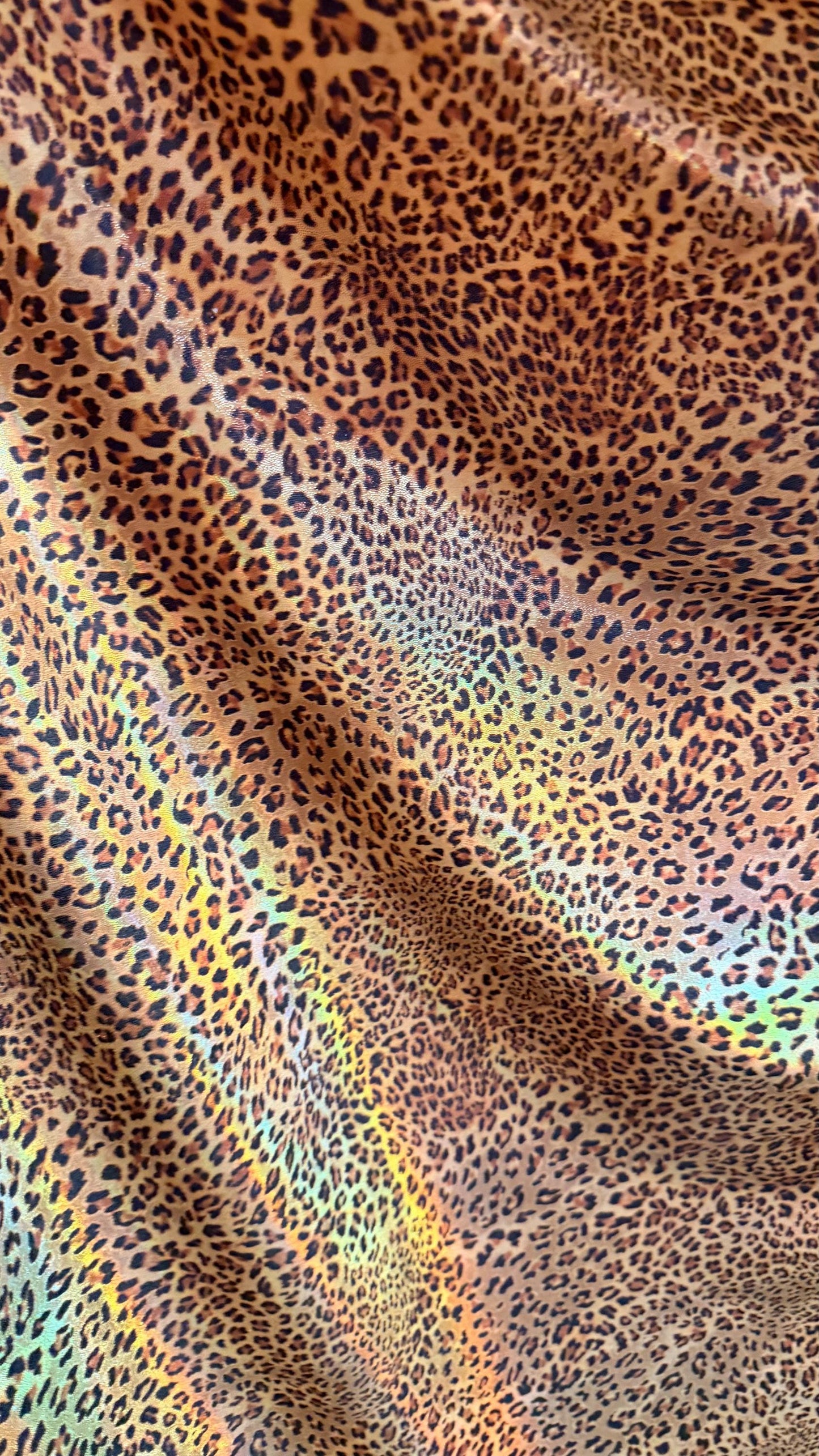New Exotic cheetah  design Iridescent metallic hologram nylon spandex 4-way spandex 58/60” Sold by the YD. Ships worldwide from Los Angeles