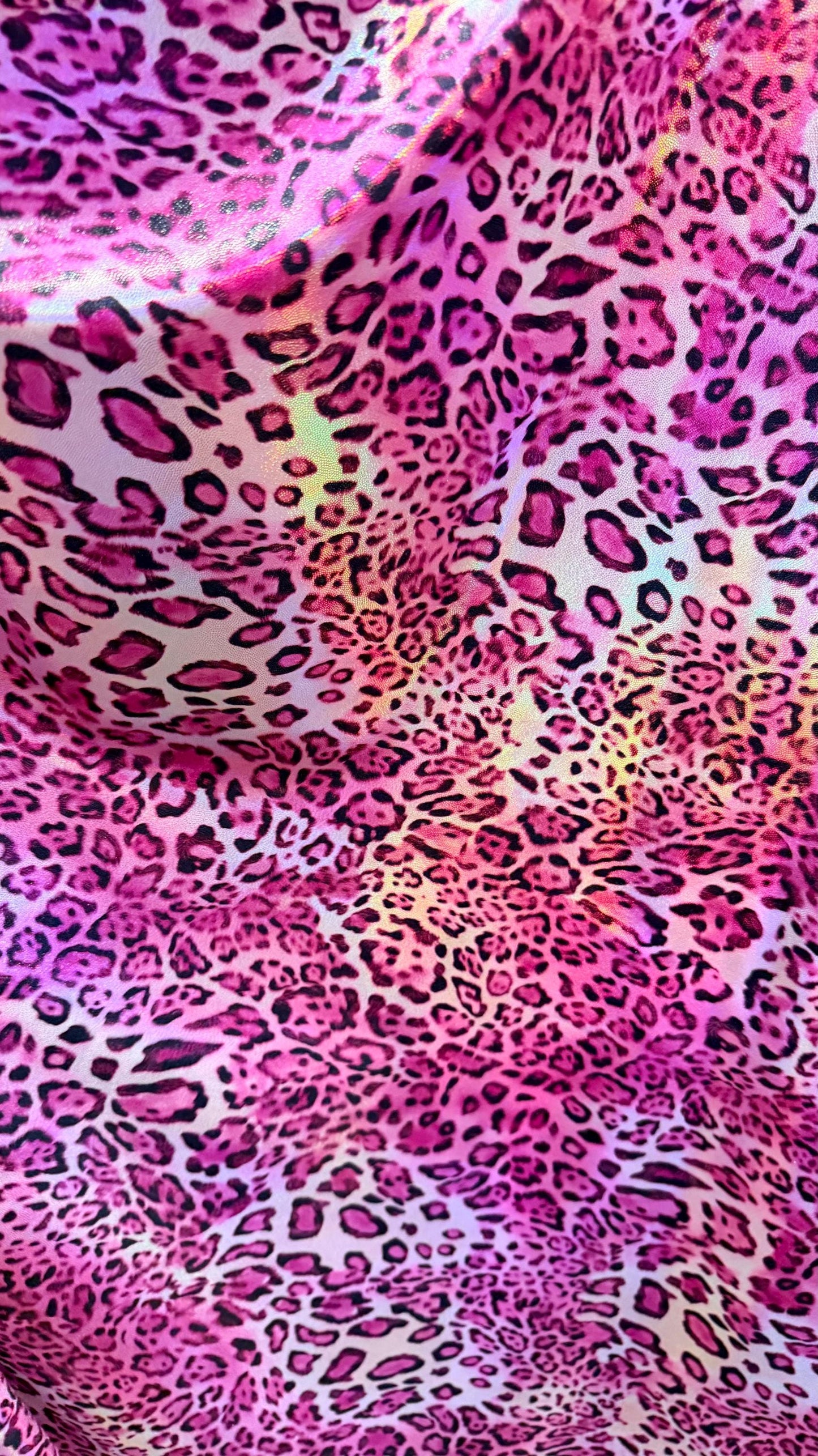New exotic Iridescent Pug Leopard design hologram nylon spandex 4-way stretch 58/60” Sold by the YD. Ships worldwide from Los Angeles CA