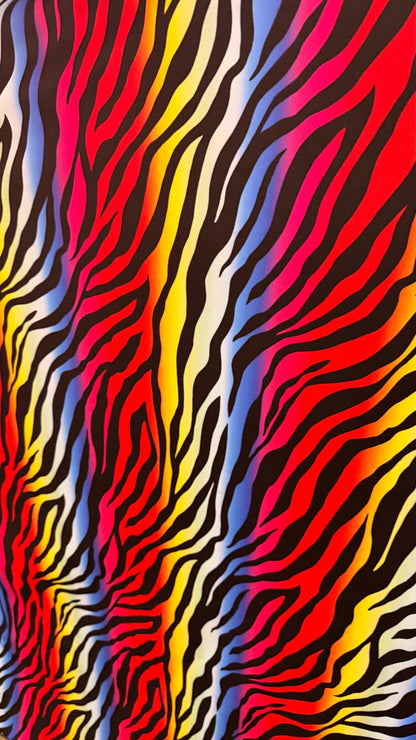 Rainbow zebra design print on nylon spandex 4way stretch 58/60" Sold by the YD. Ships worldwide from Los Angeles California USA.