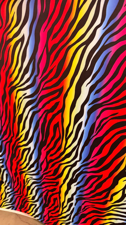 Rainbow zebra design print on nylon spandex 4way stretch 58/60" Sold by the YD. Ships worldwide from Los Angeles California USA.