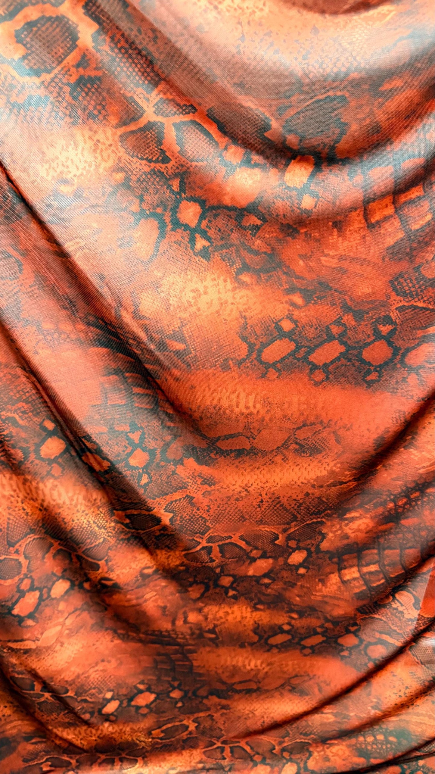 New Exotic snake design Rust/Black 4-way Stretch 58/60” Sold by the YD. Ships worldwide from Los Ángeles California USA