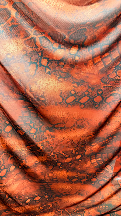 New Exotic snake design Rust/Black 4-way Stretch 58/60” Sold by the YD. Ships worldwide from Los Ángeles California USA