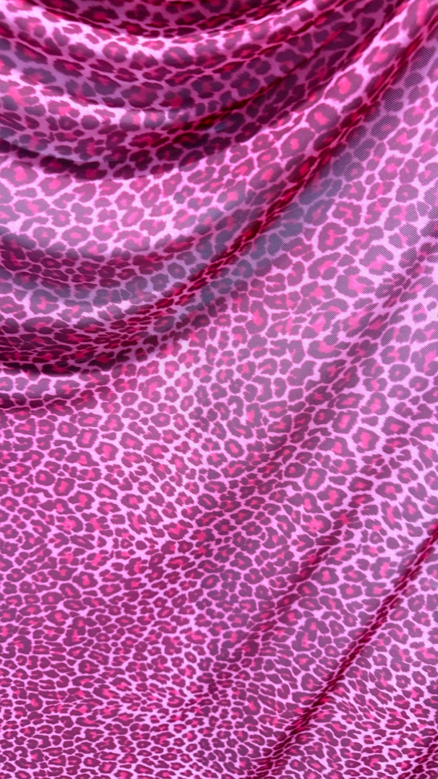 New Exotic leopard design Pink  print on power mesh 4-way stretch 58/60” Sold by the YD. Ships worldwide from Los Angeles California USA.