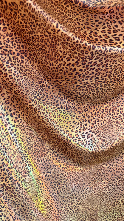 New Exotic cheetah  design Iridescent metallic hologram nylon spandex 4-way spandex 58/60” Sold by the YD. Ships worldwide from Los Angeles