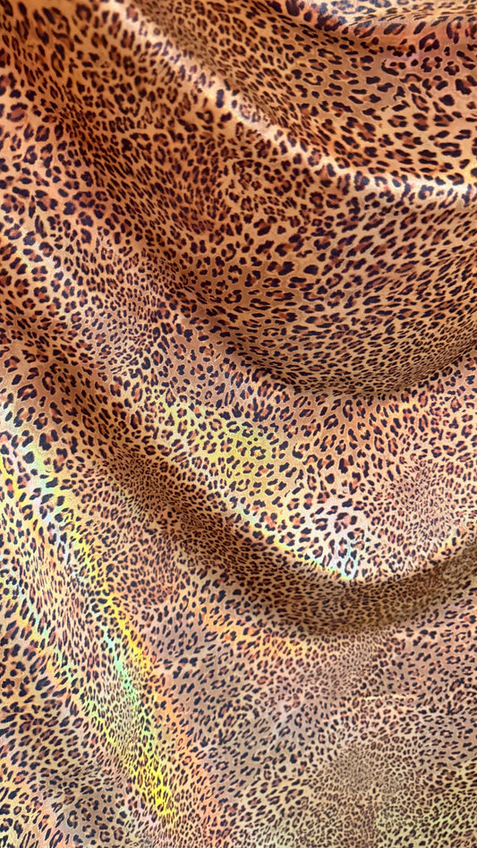 New Exotic cheetah  design Iridescent metallic hologram nylon spandex 4-way spandex 58/60” Sold by the YD. Ships worldwide from Los Angeles