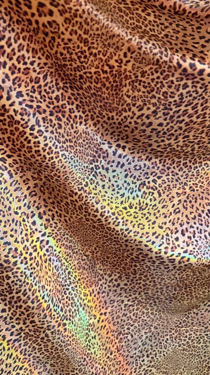 New Exotic cheetah  design Iridescent metallic hologram nylon spandex 4-way spandex 58/60” Sold by the YD. Ships worldwide from Los Angeles