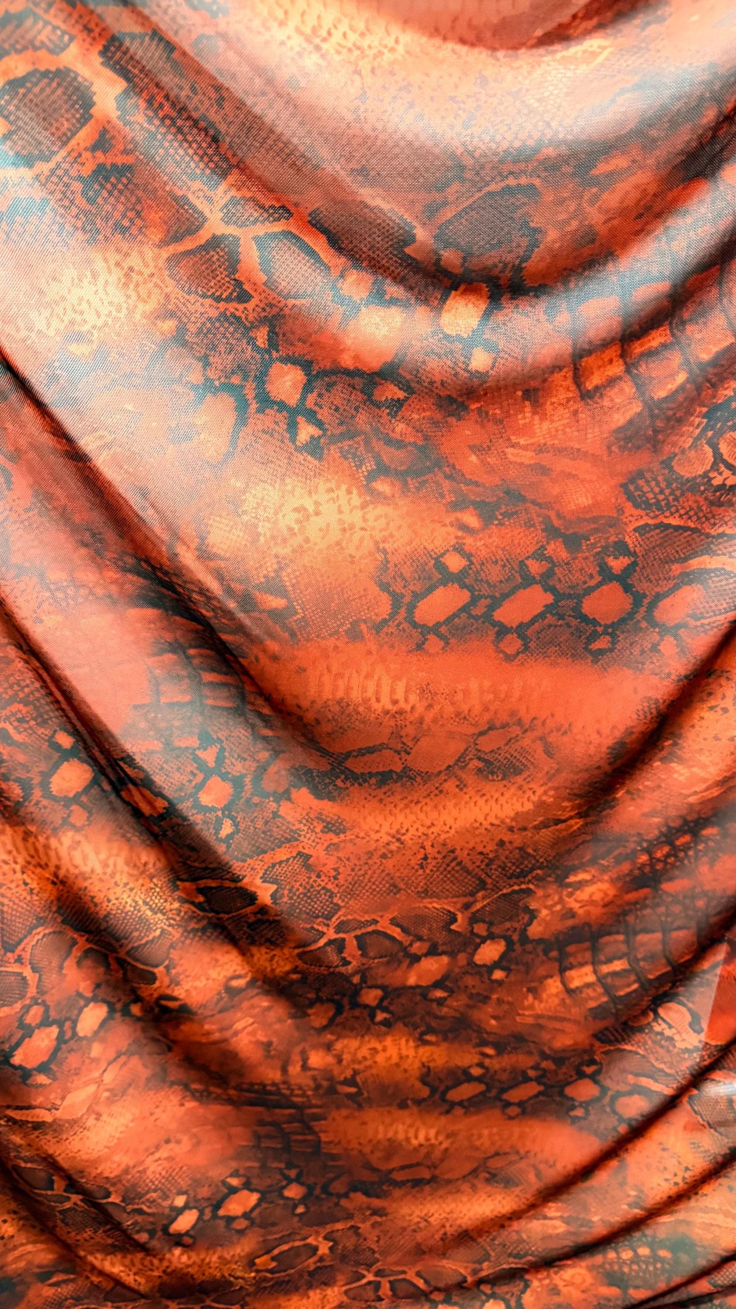 New Exotic snake design Rust/Black 4-way Stretch 58/60” Sold by the YD. Ships worldwide from Los Ángeles California USA