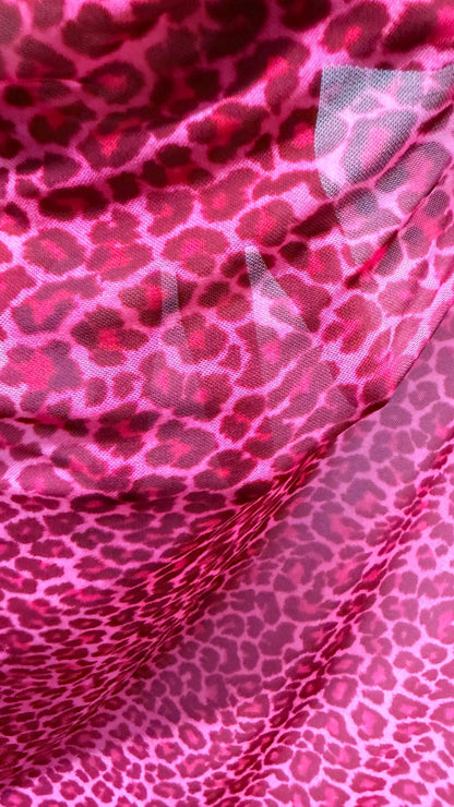New Exotic leopard design Pink  print on power mesh 4-way stretch 58/60” Sold by the YD. Ships worldwide from Los Angeles California USA.