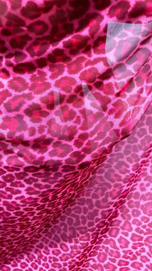 New Exotic leopard design Pink  print on power mesh 4-way stretch 58/60” Sold by the YD. Ships worldwide from Los Angeles California USA.