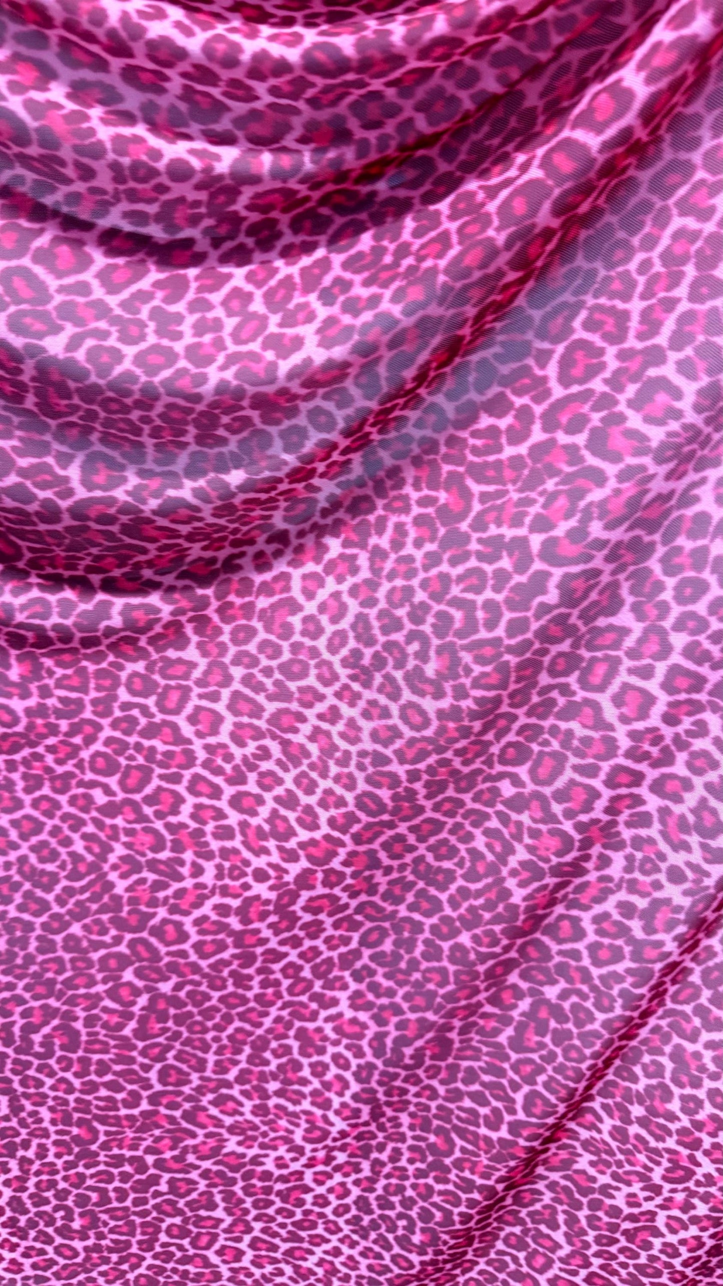 New Exotic leopard design Pink  print on power mesh 4-way stretch 58/60” Sold by the YD. Ships worldwide from Los Angeles California USA.
