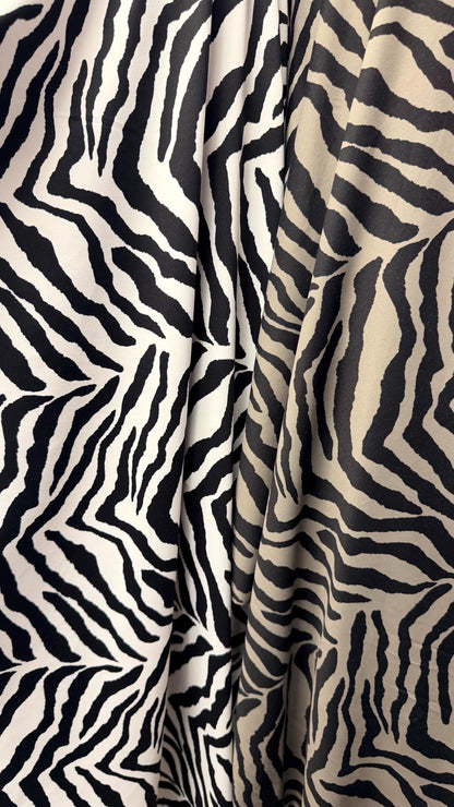 New Exotic zebra design medium size white/black & Taupe/Black print on best quality of nylon spandex 4-way stretch 58/60” Sold by the YD.