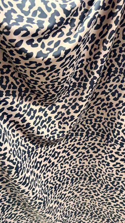 New Exotic Leopard design Taupe/Black print on nylon spandex 4way stretch 58/60" Sold by the YD. Ships worldwide from Los Angeles CA