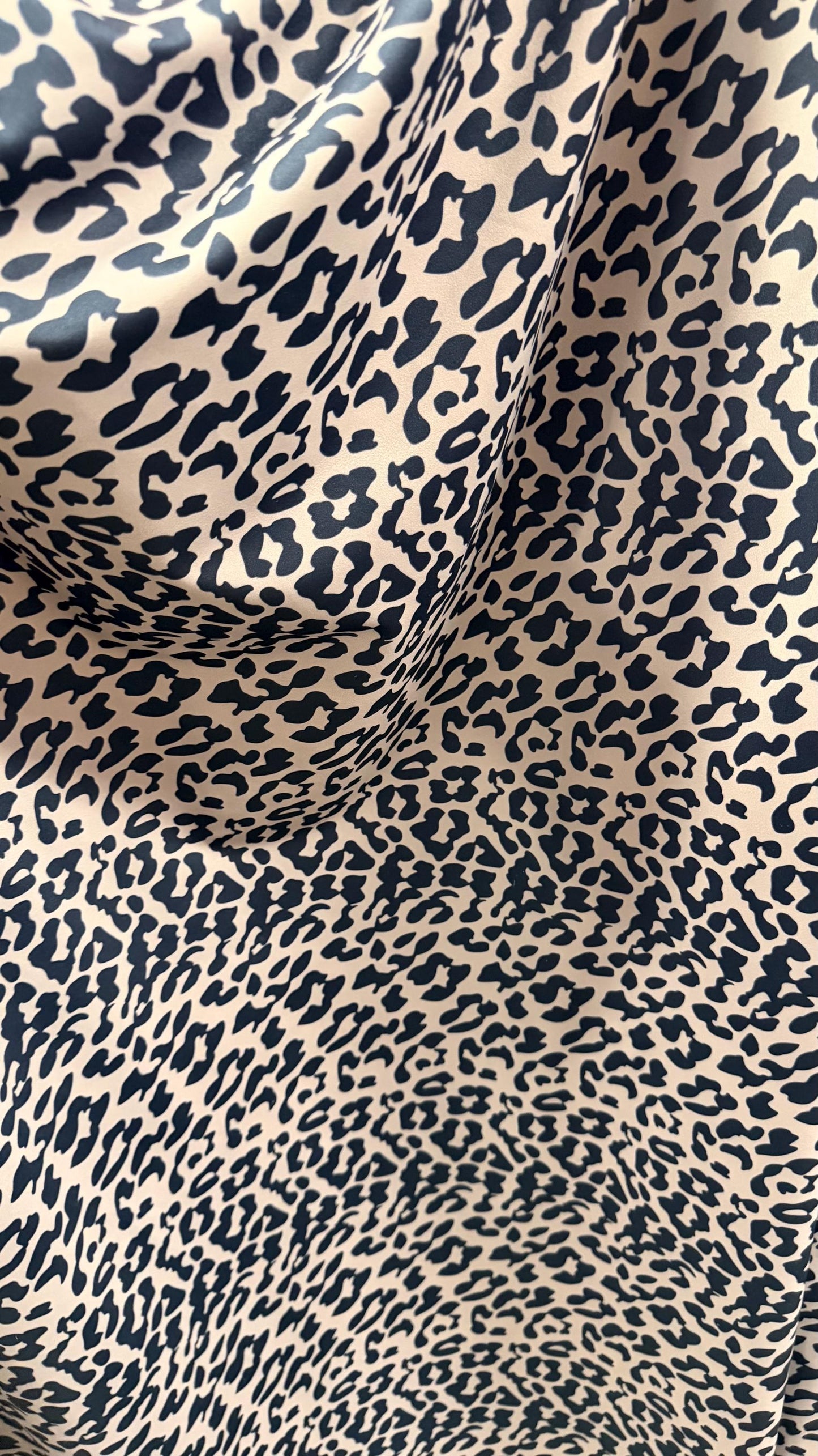 New Exotic Leopard design Taupe/Black print on nylon spandex 4way stretch 58/60" Sold by the YD. Ships worldwide from Los Angeles CA