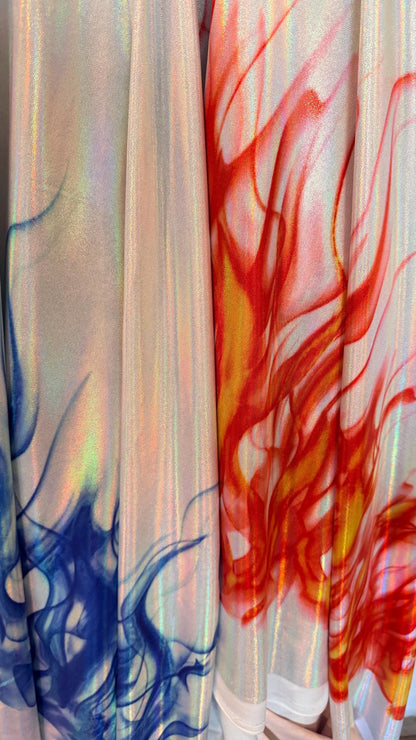 Flames design Black/Fire and White/Sapphire on Iridescent Hologram metallic nylon spandex 4-way stretch 58/60” Sold by the YD.