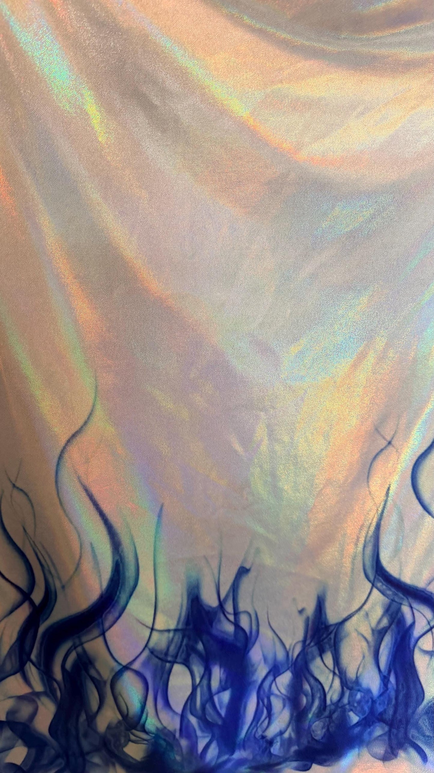Flames design Black/Fire and White/Sapphire on Iridescent Hologram metallic nylon spandex 4-way stretch 58/60” Sold by the YD.